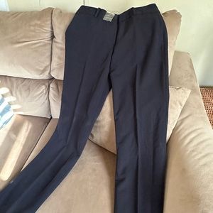 New black petite dress pants . Size 4